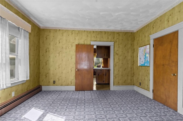 8 Tampa St, West Warwick, RI 02893 - carpeted empty room featuring a baseboard heating unit and crown molding