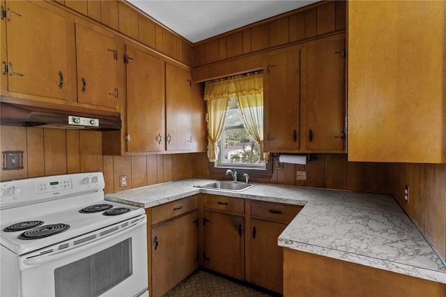 8 Tampa St, West Warwick, RI 02893 - kitchen with white range with electric cooktop, a sink, under cabinet range hood, light countertops, and wood walls
