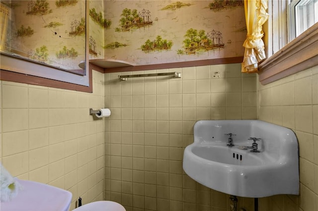 8 Tampa St, West Warwick, RI 02893 - bathroom with tile walls, wallpapered walls, a sink, wainscoting, and toilet