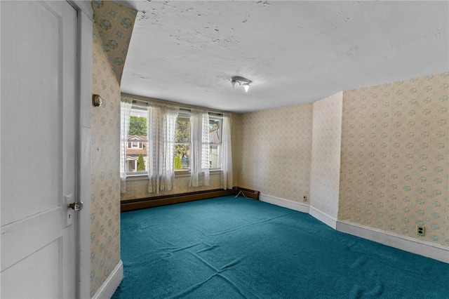 8 Tampa St, West Warwick, RI 02893 - carpeted spare room featuring wallpapered walls, baseboard heating, baseboards, and a textured ceiling