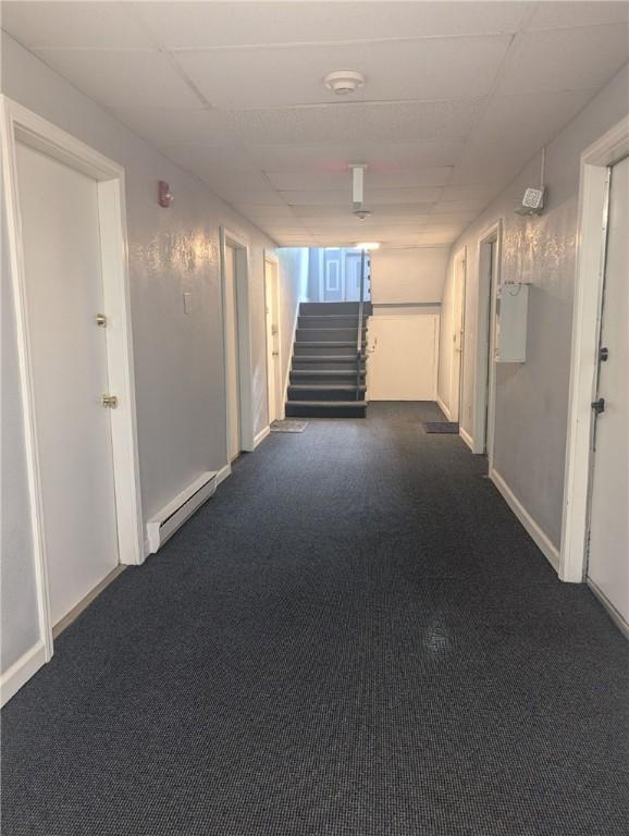 300 Smithfield Rd Unit P2-2, North Providence, RI 02904 - hall with a baseboard radiator, stairs, carpet floors, and baseboards