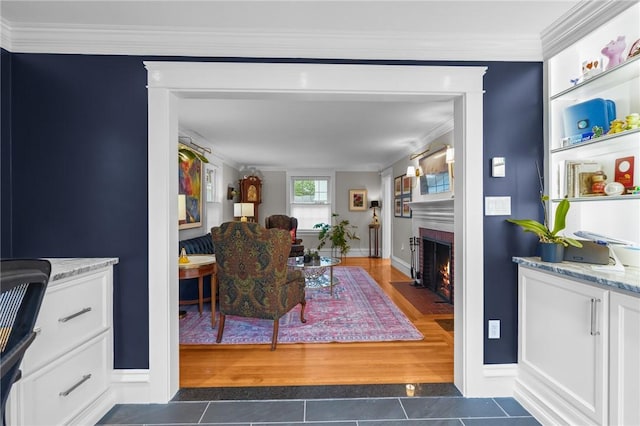 11 Elmcroft Ave, Providence, RI 02909 - living room featuring dark tile patterned floors, a fireplace, ornamental molding, and baseboards
