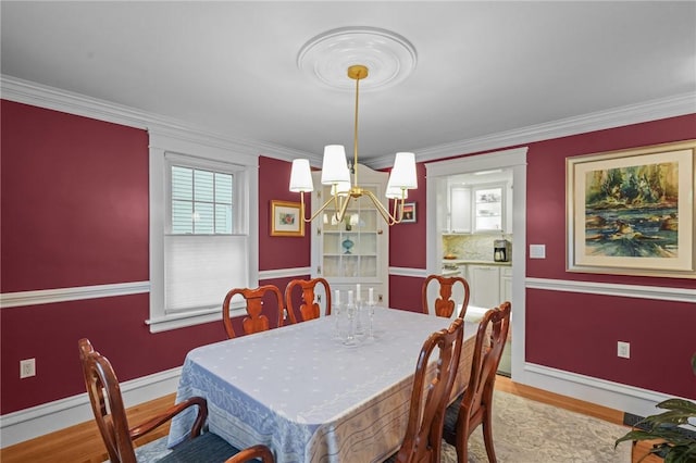11 Elmcroft Ave, Providence, RI 02909 - dining room with a chandelier, light wood-style flooring, ornamental molding, and baseboards
