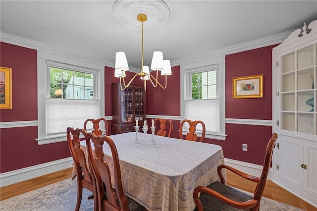 11 Elmcroft Ave, Providence, RI 02909 - dining space with a chandelier, wood finished floors, baseboards, and ornamental molding