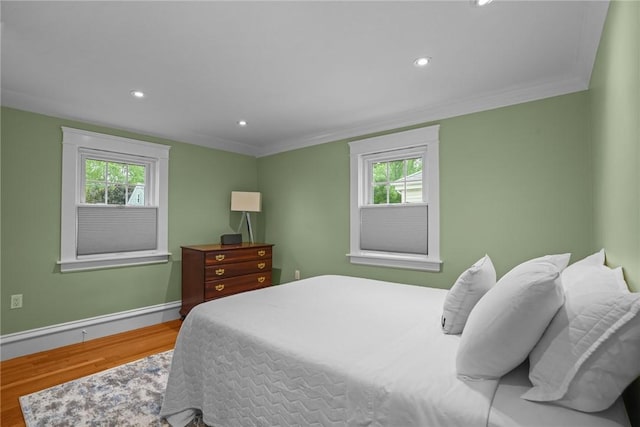 11 Elmcroft Ave, Providence, RI 02909 - bedroom featuring wood finished floors, multiple windows, crown molding, recessed lighting, and baseboards