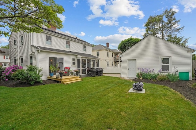 11 Elmcroft Ave, Providence, RI 02909 - rear view of property with a sunroom, a deck, and a chimney