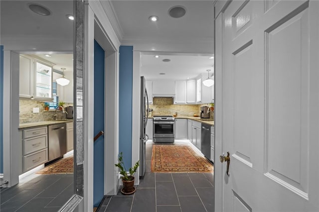 11 Elmcroft Ave, Providence, RI 02909 - hall with dark tile patterned floors, ornamental molding, a sink, and recessed lighting