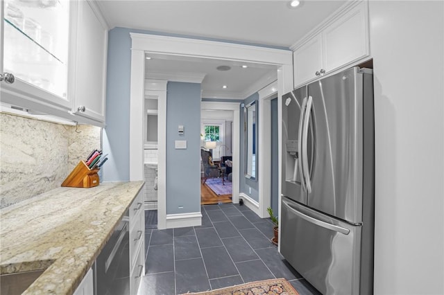 11 Elmcroft Ave, Providence, RI 02909 - kitchen with stainless steel appliances, white cabinets, backsplash, baseboards, and light stone counters
