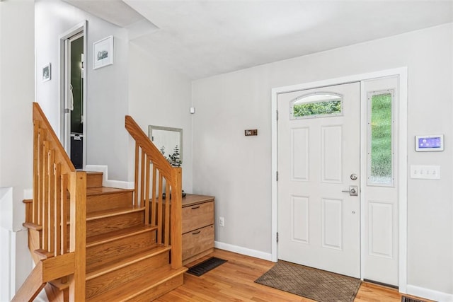 11 Noto Dr, North Providence, RI 02904 - foyer entrance featuring light wood finished floors, baseboards, and stairway