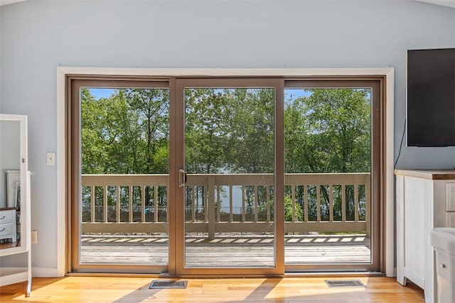 11 Noto Dr, North Providence, RI 02904 - doorway to outside featuring wood finished floors and baseboards