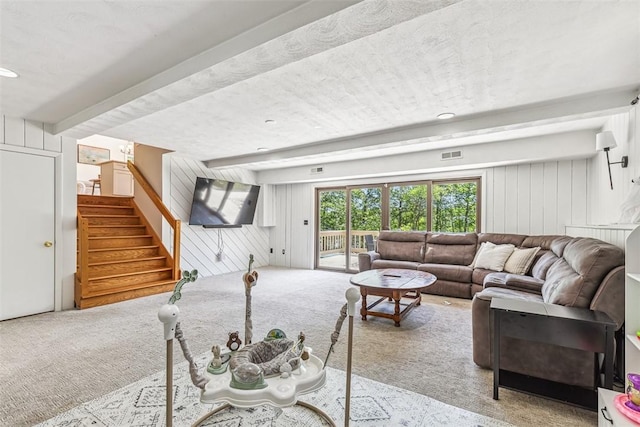 11 Noto Dr, North Providence, RI 02904 - carpeted living area with wooden walls, beam ceiling, stairs, and recessed lighting