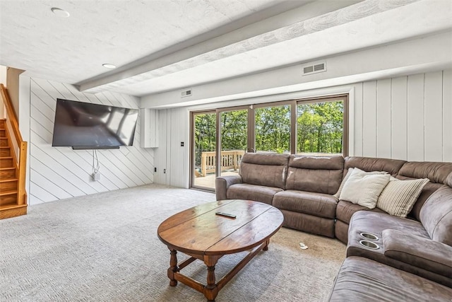 11 Noto Dr, North Providence, RI 02904 - living area featuring carpet, stairs, beamed ceiling, and wood walls