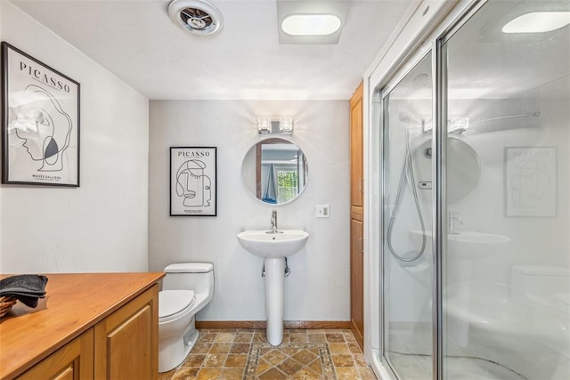 11 Noto Dr, North Providence, RI 02904 - full bathroom featuring toilet, stone finish flooring, baseboards, and a shower stall