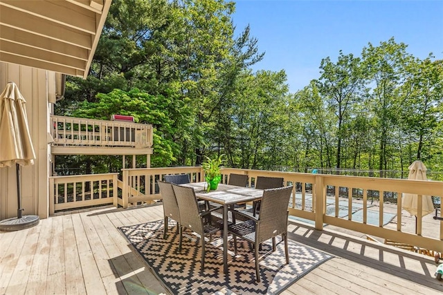 11 Noto Dr, North Providence, RI 02904 - deck featuring outdoor dining area and view of wooded area