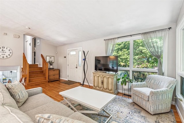 11 Noto Dr, North Providence, RI 02904 - living area with stairway, wood finished floors, and baseboards