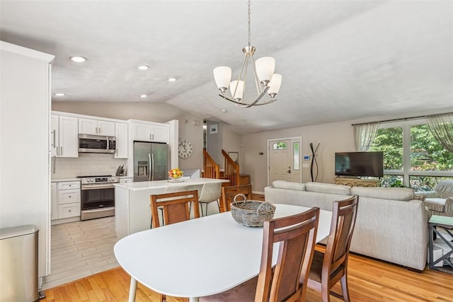 11 Noto Dr, North Providence, RI 02904 - dining space featuring stairway, a chandelier, light wood-type flooring, lofted ceiling, and recessed lighting