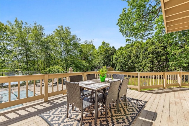 11 Noto Dr, North Providence, RI 02904 - wooden terrace featuring outdoor dining space and view of scattered trees