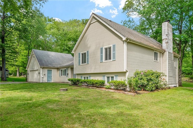 8 Westgate Rd, Cumberland, RI 02864 - view of front of home featuring a chimney, a front yard, and a garage