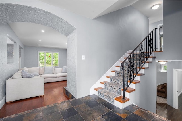 8 Westgate Rd, Cumberland, RI 02864 - stairs featuring arched walkways, wood finished floors, and recessed lighting