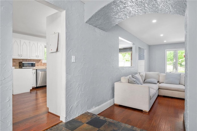 8 Westgate Rd, Cumberland, RI 02864 - living room with a textured wall, dark wood-style flooring, recessed lighting, and baseboards