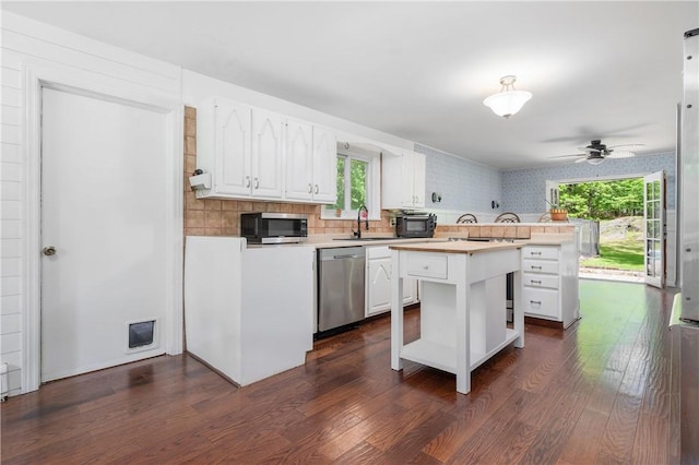8 Westgate Rd, Cumberland, RI 02864 - kitchen featuring stainless steel appliances, white cabinets, light countertops, dark wood-style flooring, and wallpapered walls