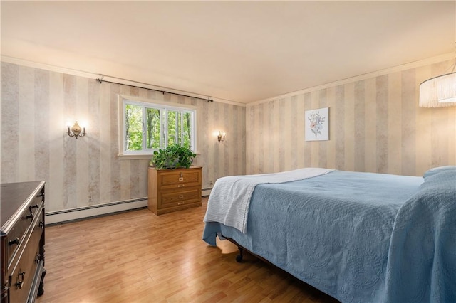 8 Westgate Rd, Cumberland, RI 02864 - bedroom with a baseboard heating unit and light wood-style floors