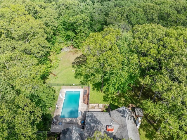 8 Westgate Rd, Cumberland, RI 02864 - drone / aerial view of a pool area and a heavily wooded area