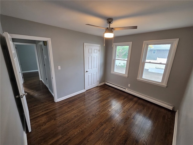 119 Evergreen Ave, Tiverton, RI 02878 - unfurnished bedroom with a baseboard radiator, dark wood-style floors, baseboards, and a ceiling fan