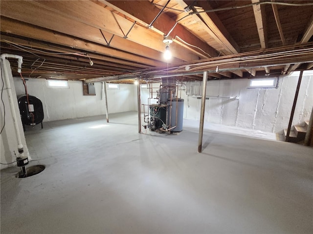 119 Evergreen Ave, Tiverton, RI 02878 - below grade area with a heating unit, oil tank, and plenty of natural light