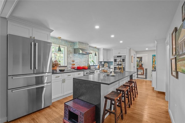 25 King Philip Rd, Pawtucket, RI 02861 - kitchen featuring appliances with stainless steel finishes, dark countertops, white cabinets, backsplash, and recessed lighting