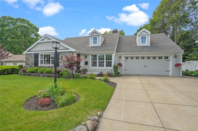 25 King Philip Rd, Pawtucket, RI 02861 - view of front of house featuring a garage, a front yard, concrete driveway, roof with shingles, and a chimney