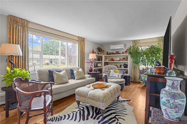 25 King Philip Rd, Pawtucket, RI 02861 - living area featuring a wall mounted AC and wood finished floors