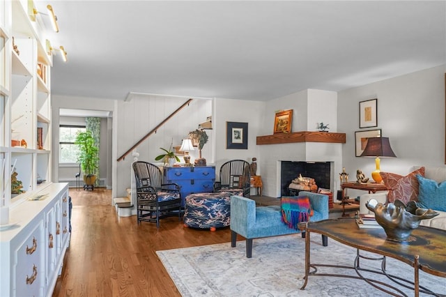 25 King Philip Rd, Pawtucket, RI 02861 - living area with wood finished floors, a fireplace, and stairway