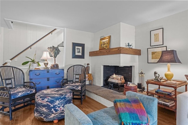 25 King Philip Rd, Pawtucket, RI 02861 - living room featuring wood finished floors and a warm lit fireplace