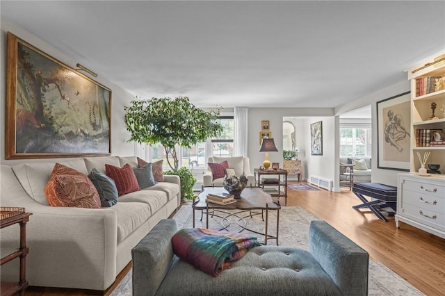 25 King Philip Rd, Pawtucket, RI 02861 - living room with wood finished floors, plenty of natural light, and arched walkways
