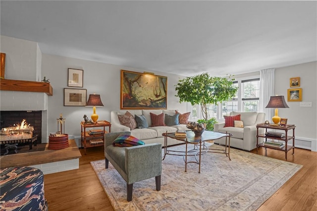 25 King Philip Rd, Pawtucket, RI 02861 - living room with a brick fireplace and wood finished floors