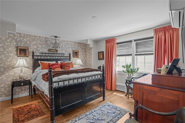 25 King Philip Rd, Pawtucket, RI 02861 - bedroom with wallpapered walls, wood finished floors, and baseboards
