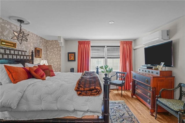 25 King Philip Rd, Pawtucket, RI 02861 - bedroom with wallpapered walls, wood finished floors, and an AC wall unit