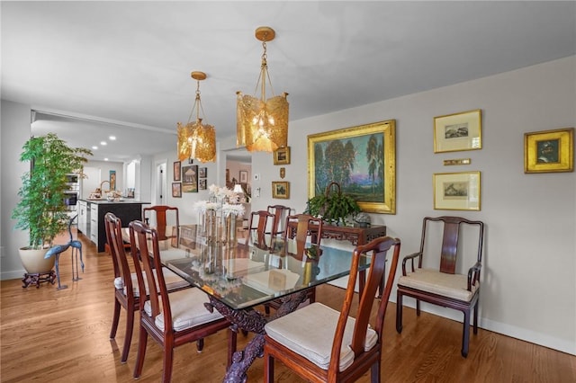 25 King Philip Rd, Pawtucket, RI 02861 - dining space with wood finished floors, baseboards, and a chandelier