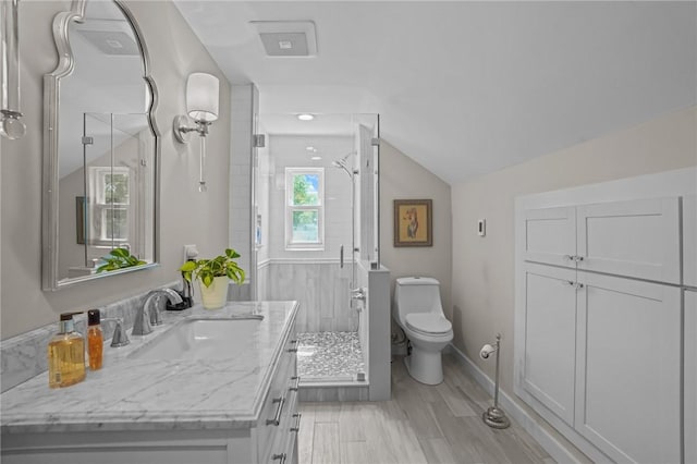 25 King Philip Rd, Pawtucket, RI 02861 - bathroom featuring vanity, a shower stall, toilet, vaulted ceiling, and baseboards