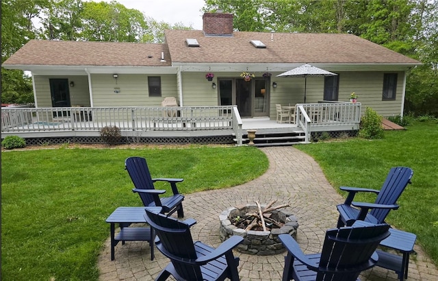 190 Broad Rock Rd, South Kingstown, RI 02879 - back of property with a fire pit, a chimney, a patio area, and a yard