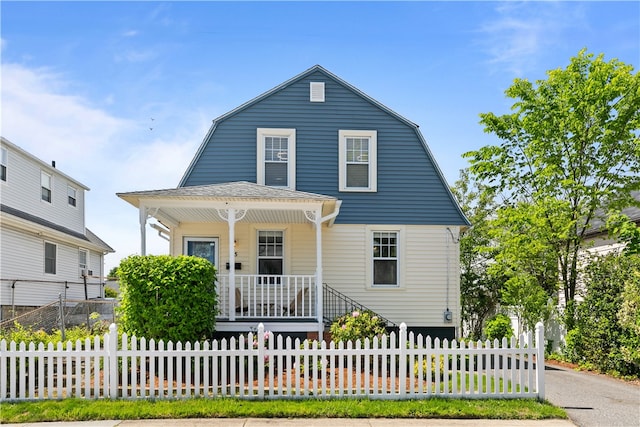 155 Quarry St, East Providence, RI 02914 - colonial inspired home with covered porch, a gambrel roof, and a fenced front yard