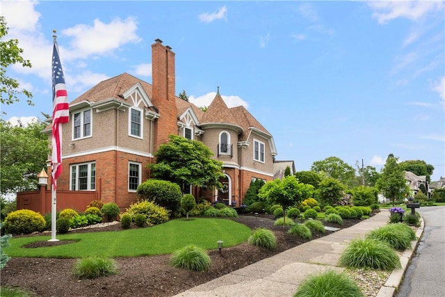 34 Dryden Ave, Pawtucket, RI 02860 - view of front of property with a chimney and a front lawn