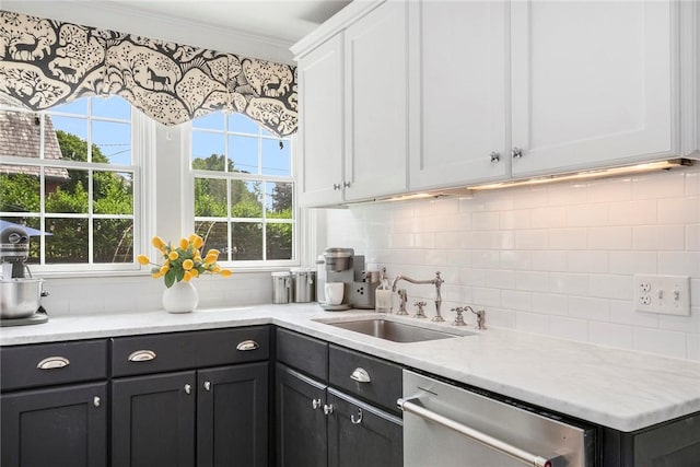 34 Dryden Ave, Pawtucket, RI 02860 - kitchen with stainless steel dishwasher, a sink, tasteful backsplash, white cabinets, and light countertops