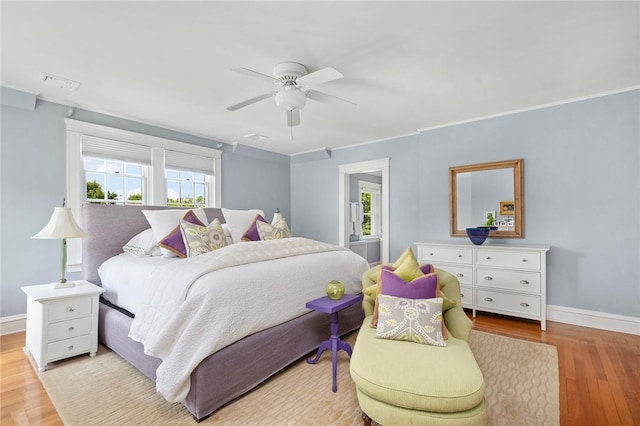 34 Dryden Ave, Pawtucket, RI 02860 - bedroom with multiple windows, wood finished floors, baseboards, and a ceiling fan