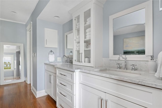 34 Dryden Ave, Pawtucket, RI 02860 - full bath featuring double vanity, wood finished floors, baseboards, and crown molding