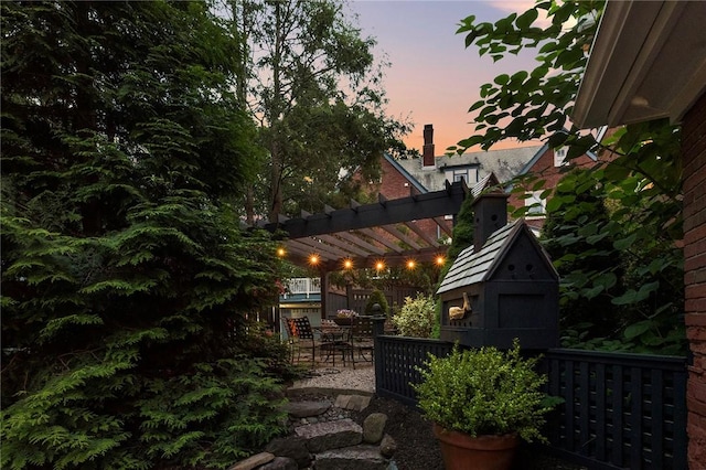 34 Dryden Ave, Pawtucket, RI 02860 - yard at dusk featuring a pergola, a patio, and outdoor dining area