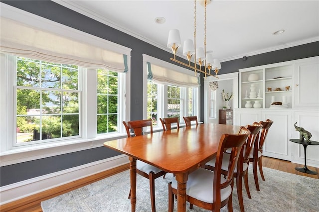 34 Dryden Ave, Pawtucket, RI 02860 - dining room featuring crown molding, a chandelier, and light wood-type flooring