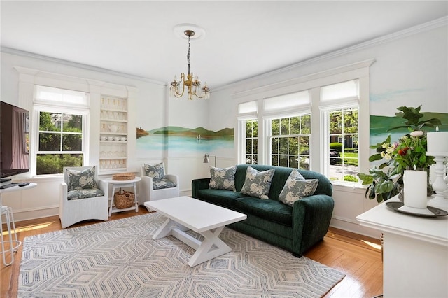 34 Dryden Ave, Pawtucket, RI 02860 - living room with ornamental molding, a chandelier, and light wood-style floors