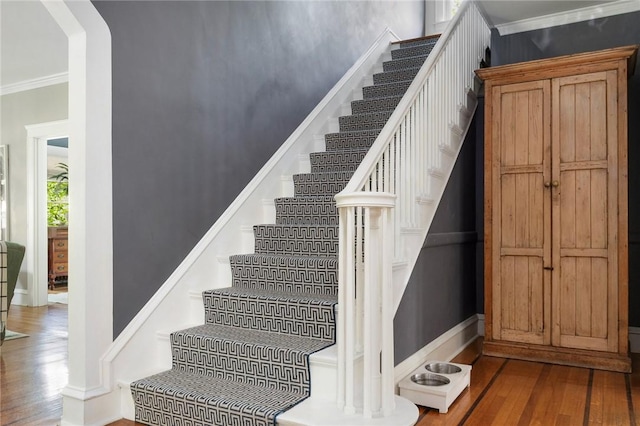 34 Dryden Ave, Pawtucket, RI 02860 - stairs with wood finished floors, ornamental molding, baseboards, and arched walkways